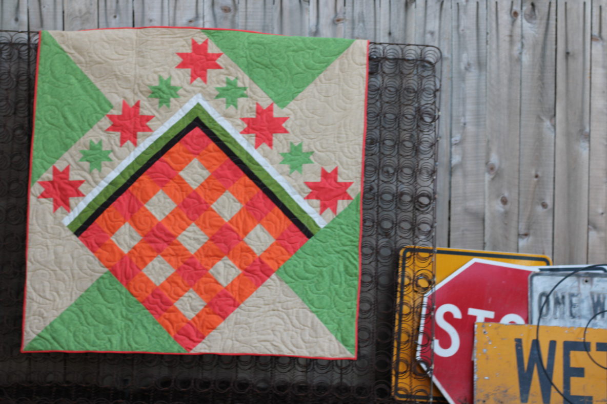 Handmade quilt hanging on a wall